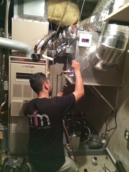 Mario, Lead Technician of M&M Cellar Systems Relacing an Old Wine cellar Cooling System